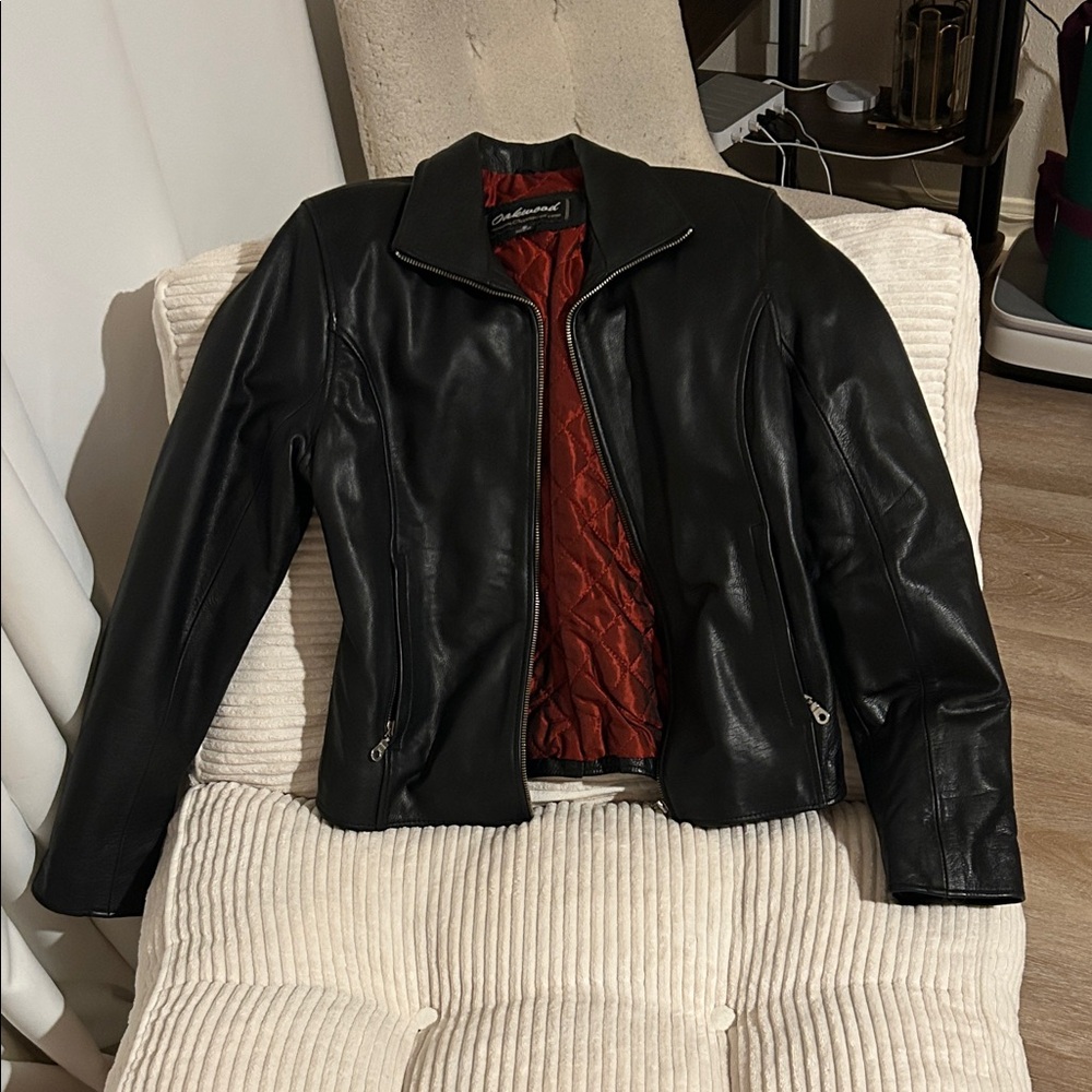 Elegant Black Leather Jacket with Red Interior